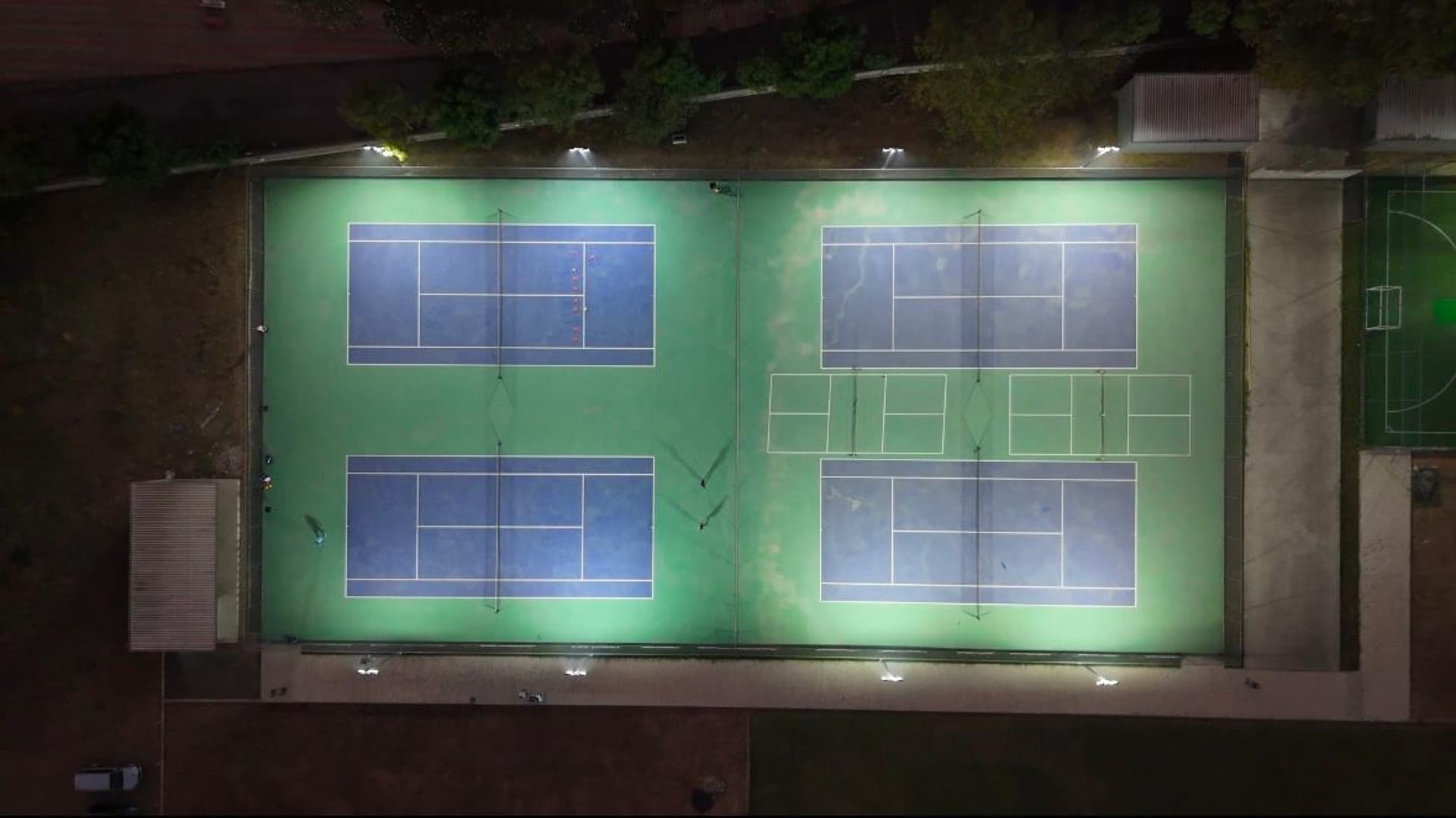 Aerial view of the tennis courts at Drona Sports Academy